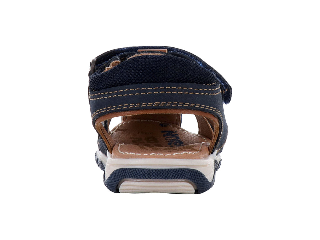 Sandalias infantiles Teen Bambino color azul marino con suela blanca y cierre de velcro.
