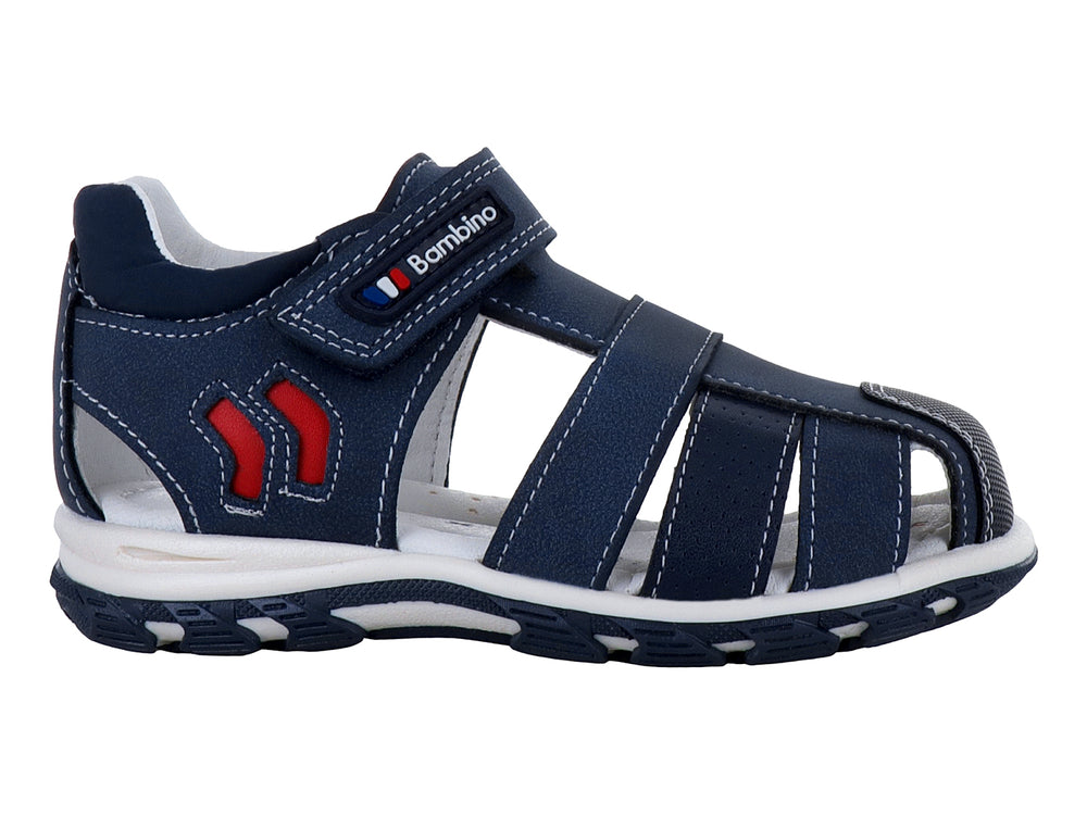 Sandalia cerrada para niño en color azul marino con detalles rojos y suela blanca.