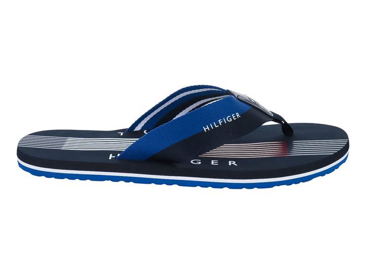 Sandalias Tommy Hilfiger color azul marino con detalles en blanco y azul brillante, diseño de rayas.