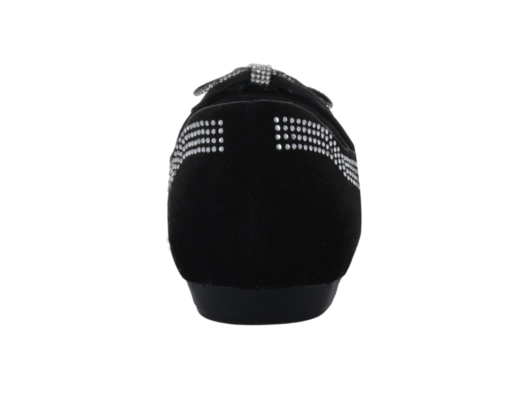 Zapato plano negro para niña con moño y detalles de brillantes laterales.