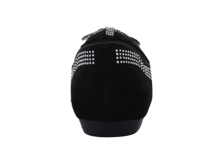 Zapato plano negro para niña con moño y detalles de brillantes laterales.