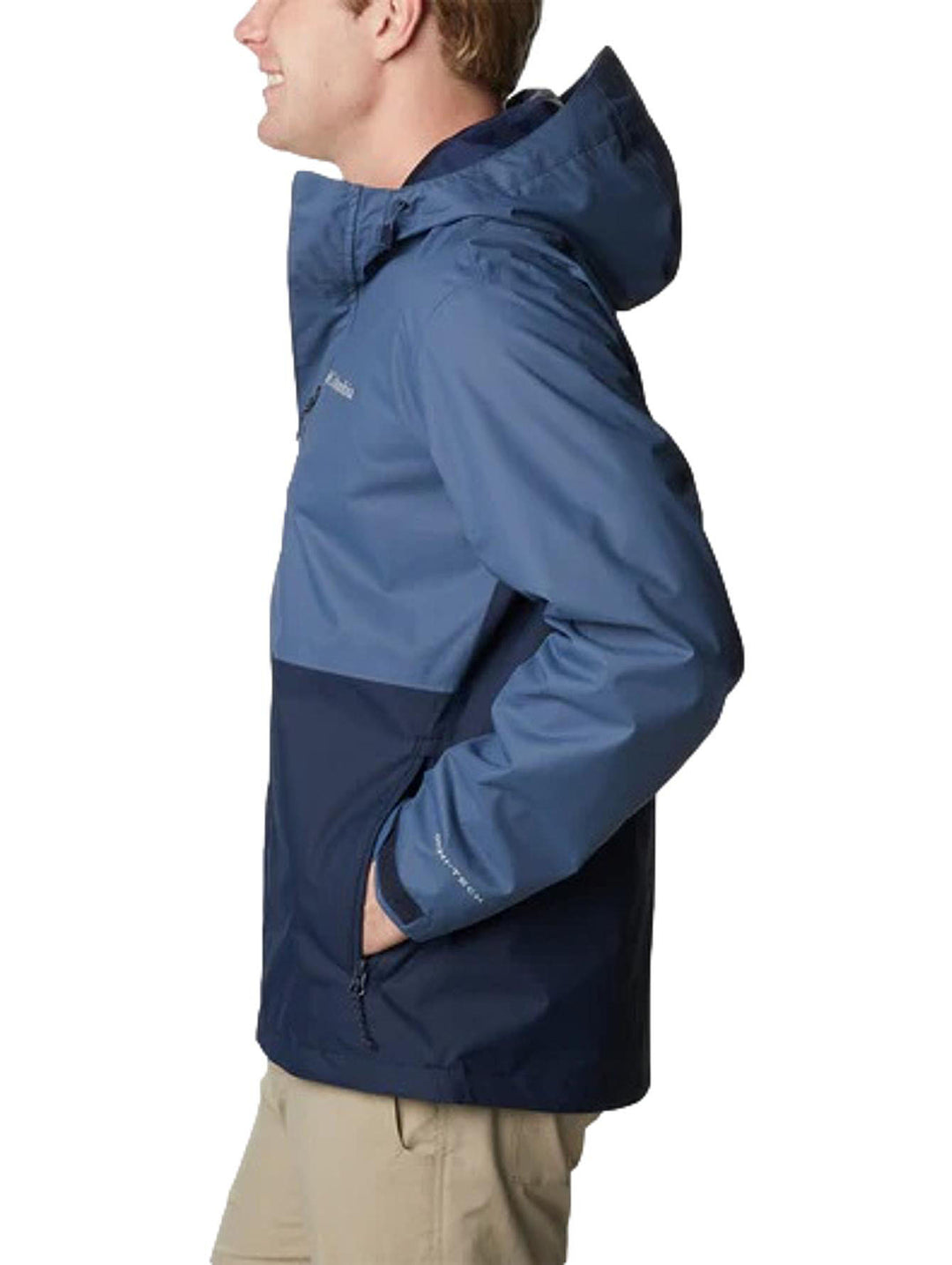 Chaqueta Columbia de dos tonos de azul con capucha, diseñada para actividades al aire libre.