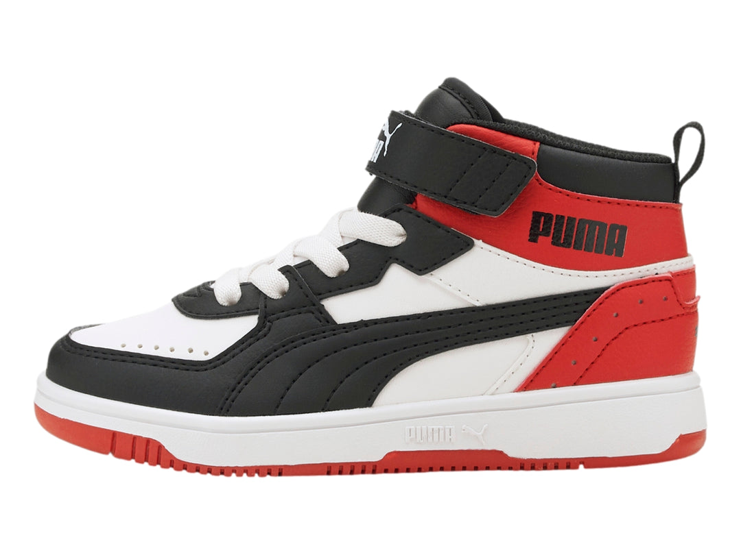 Tenis PUMA Rebound Joy AC PS en colores blanco, negro y rojo con diseño de bota alta y correa de velcro.