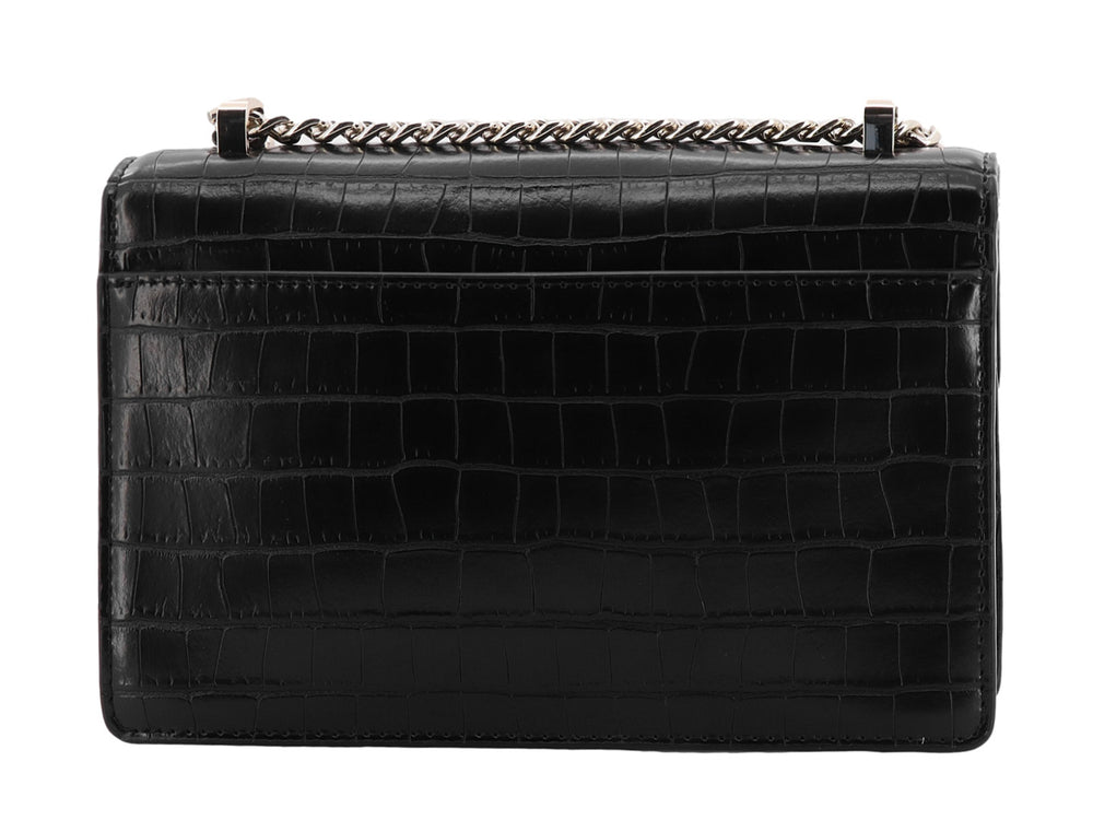 Bolso negro DKNY con textura de cocodrilo, cadena dorada y detalle de candado decorativo frontal.