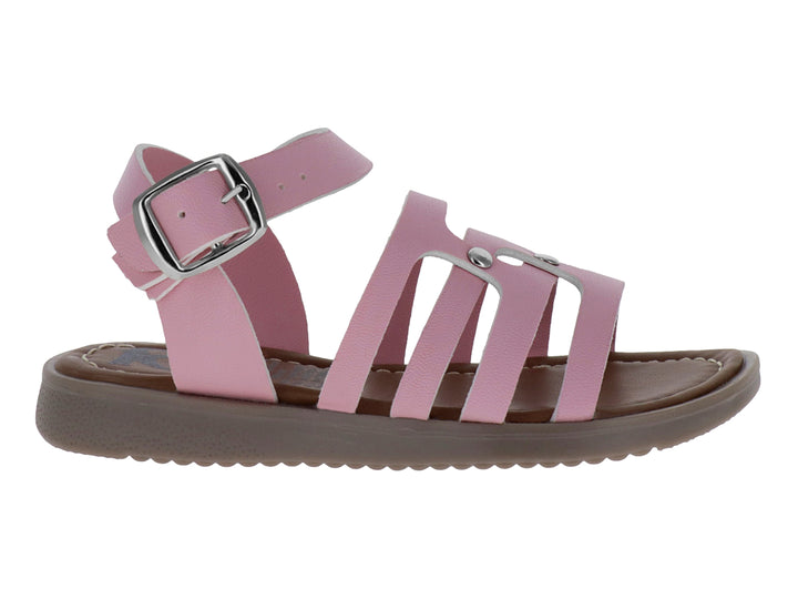 Sandalia infantil color rosa con tiras cruzadas, hebilla plateada y suela marrón.