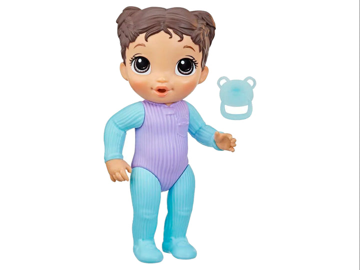 Muñeca Baby Alive con pijama azul y morada, incluye chupón, en empaque rosa.