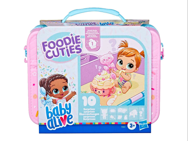 Set de juguete Baby Alive Foodie Cuties en maletín rosa con asa azul y empaque colorido.