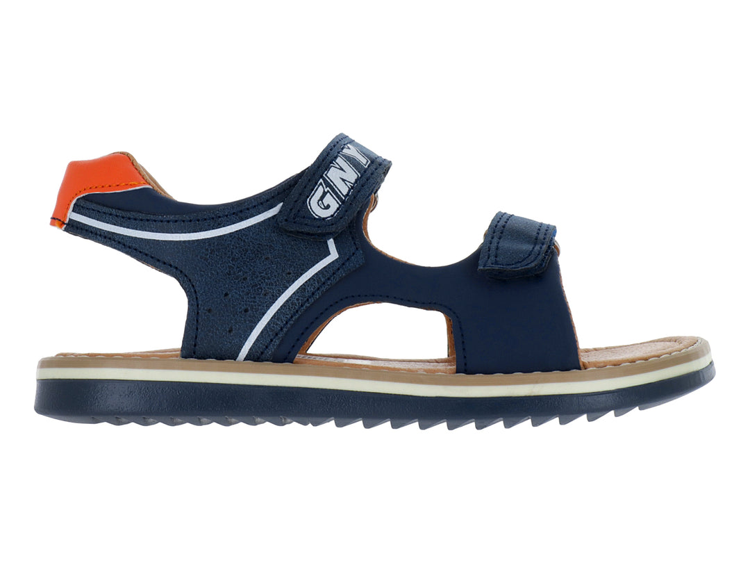 Sandalia infantil color azul marino con tiras de velcro y detalles en blanco y naranja.