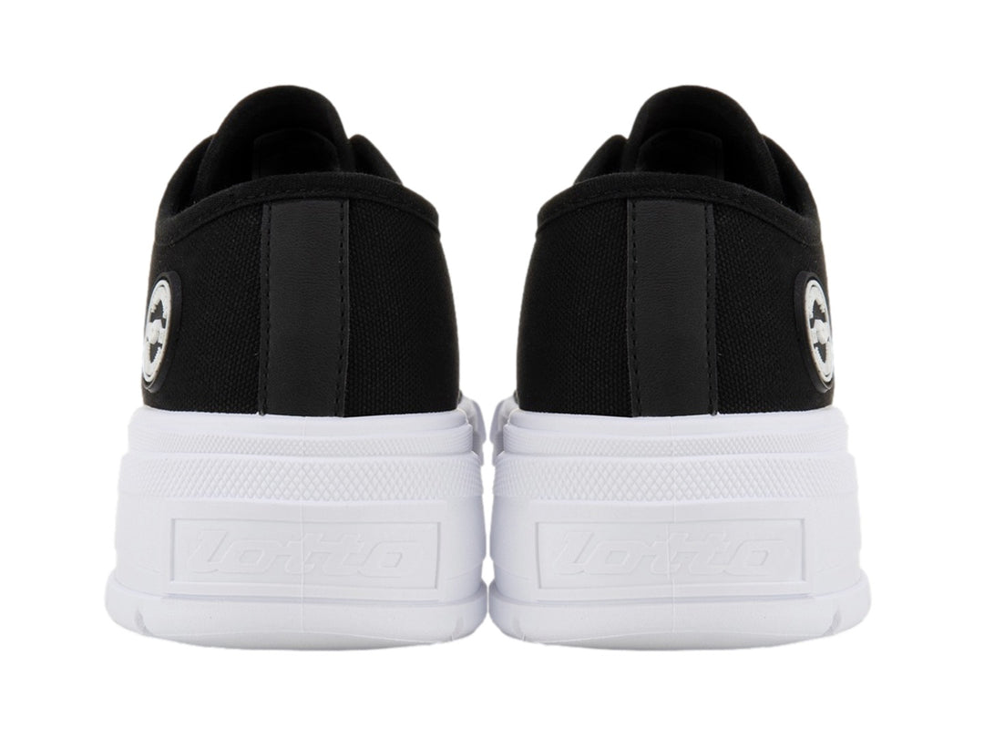 Tenis Lotto Ruvin W Low color negro con suela blanca ancha y cordones blancos.
