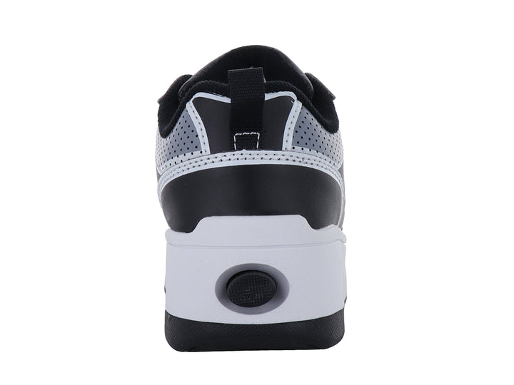 Tenis Heelys en colores negro, gris y amarillo con suela de plataforma blanca y negra.