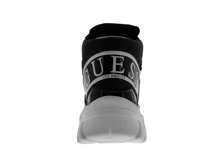 Tenis Guess GW Calvyn color negro con suela blanca ancha y cordones blancos.