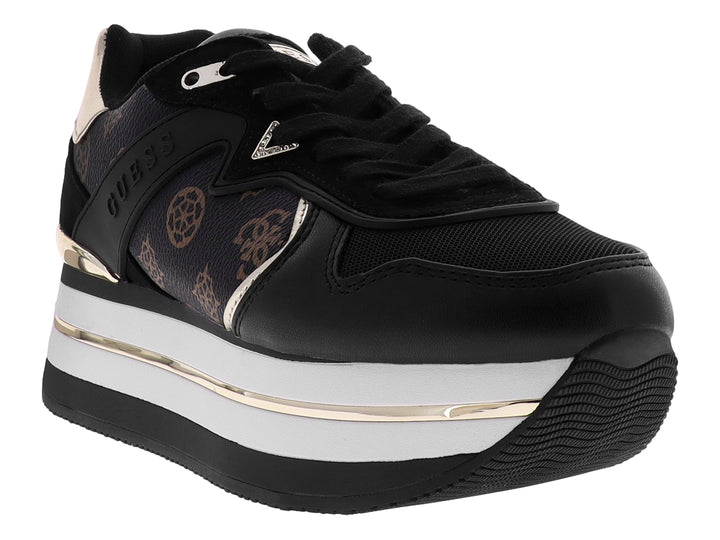 Tenis negros de plataforma marca GUESS con detalles en blanco y oro rosa y estampado de monograma lateral.