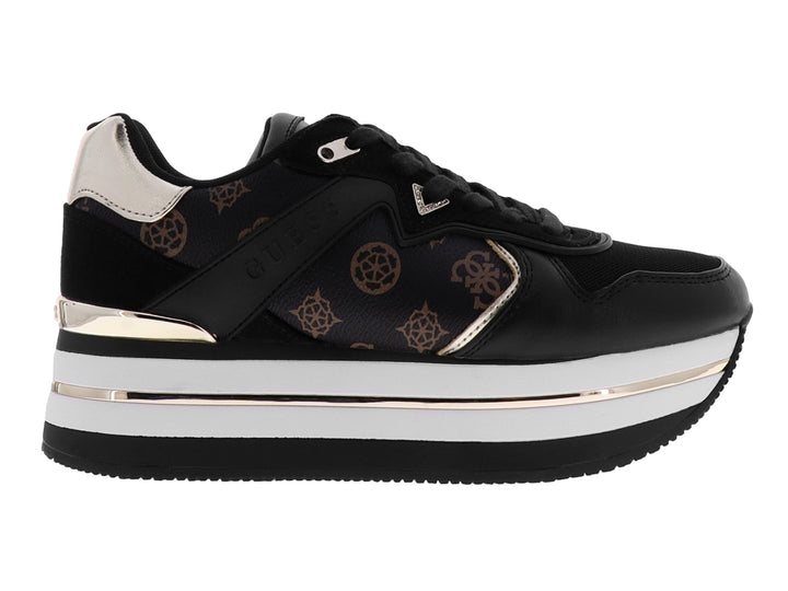 Tenis negros de plataforma marca GUESS con detalles en blanco y oro rosa y estampado de monograma lateral.