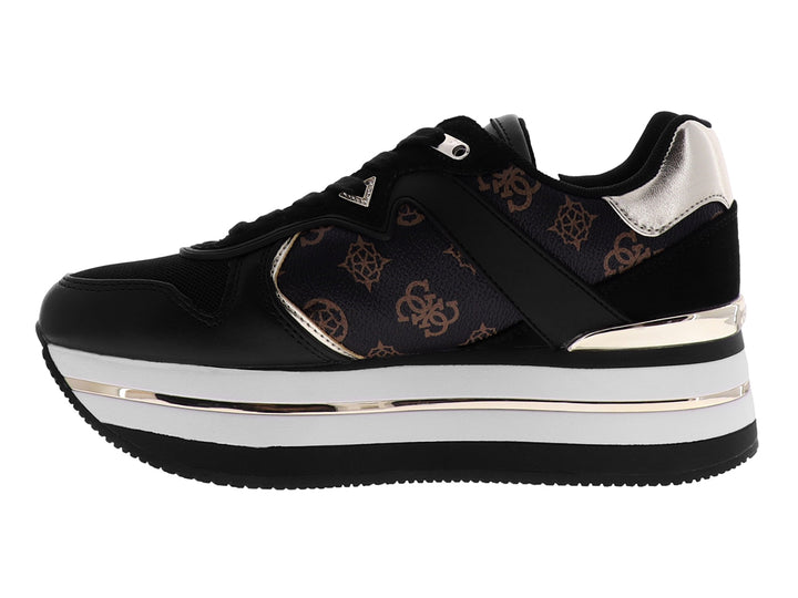 Tenis negros de plataforma marca GUESS con detalles en blanco y oro rosa y estampado de monograma lateral.