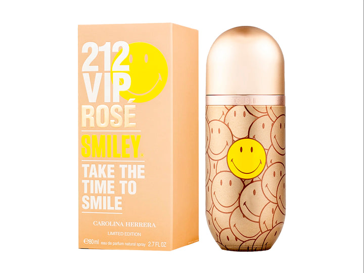 Perfume Carolina Herrera 212 VIP Rose Smiley en frasco y caja dorada con estampado de caritas sonrientes amarillas.