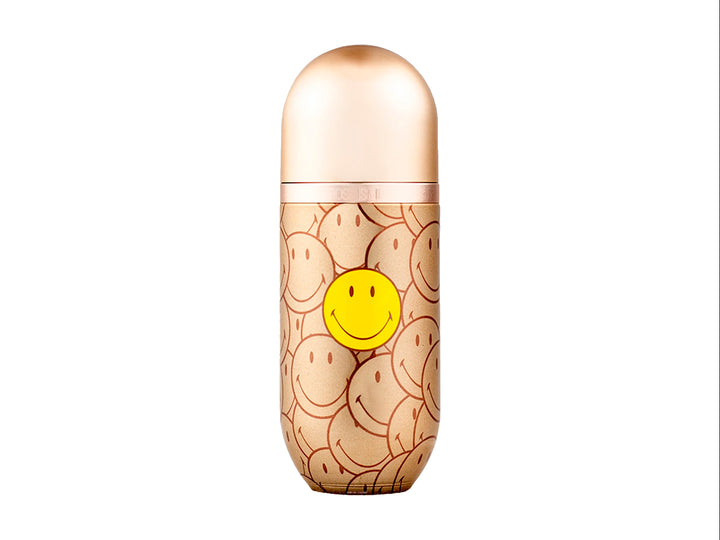 Perfume Carolina Herrera 212 VIP Rose Smiley en frasco y caja dorada con estampado de caritas sonrientes amarillas.