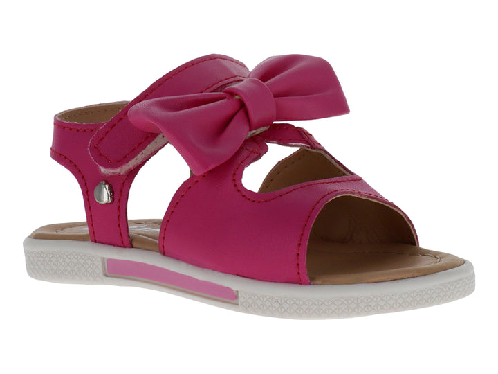 Sandalia infantil color fucsia con un moño decorativo en la parte superior y suela blanca.
