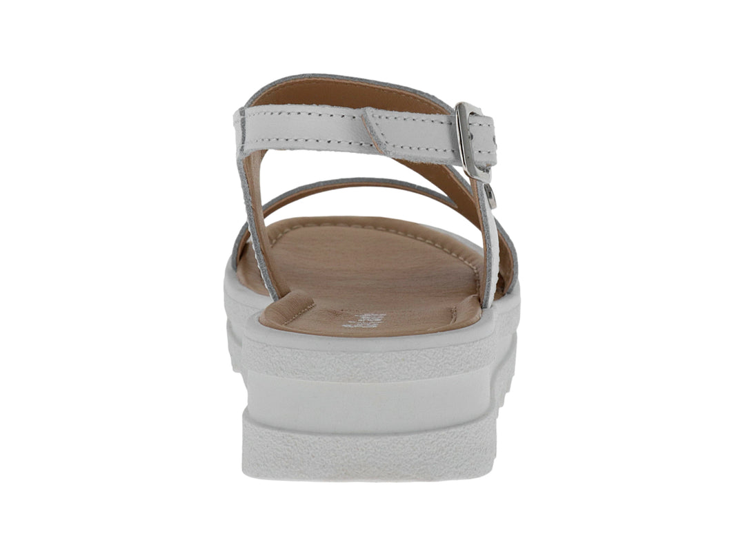 Sandalia blanca de plataforma con suela dentada y correa ajustable.