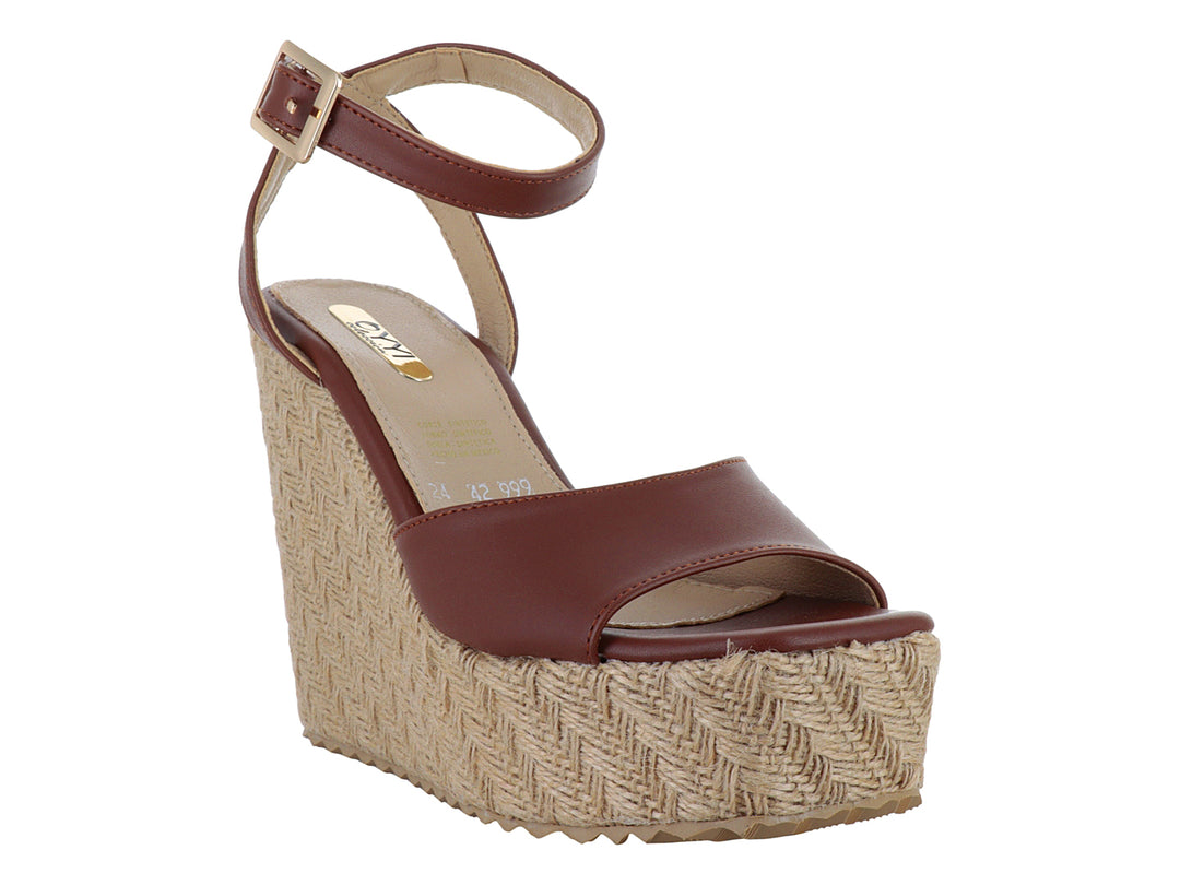 Sandalia color tan con plataforma de cuña tejida y correa ajustable al tobillo para mujer.
