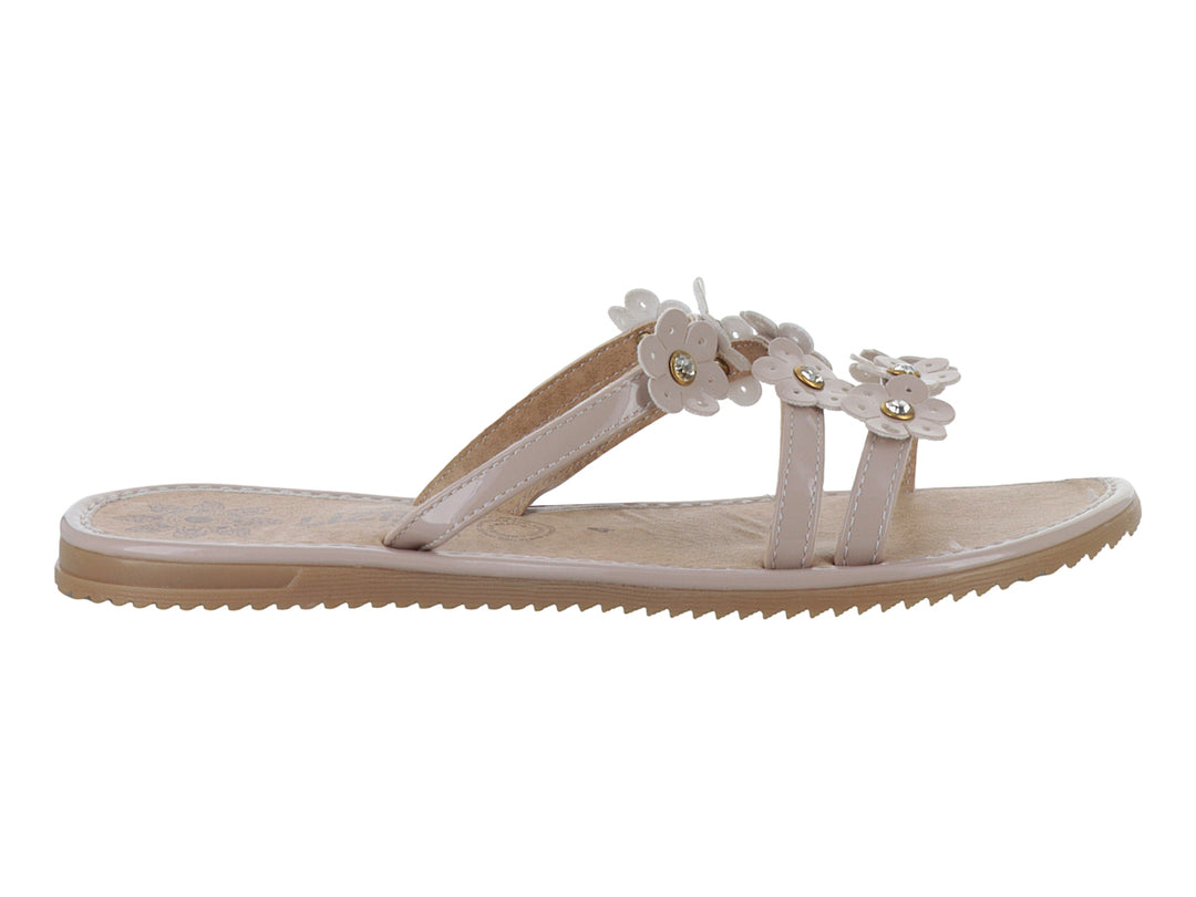 Sandalias planas color maquillaje con detalles de flores decorativas en la parte superior.