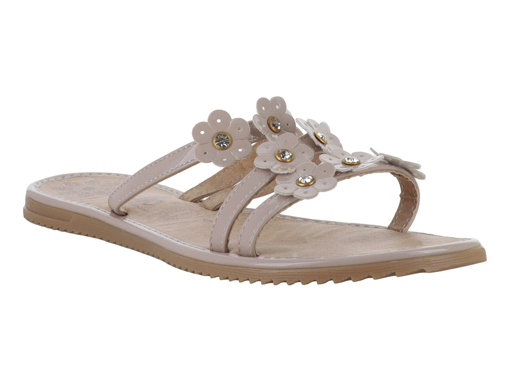 Sandalias planas color maquillaje con detalles de flores decorativas en la parte superior.