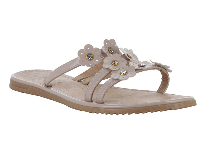 Sandalias planas color maquillaje con detalles de flores decorativas en la parte superior.