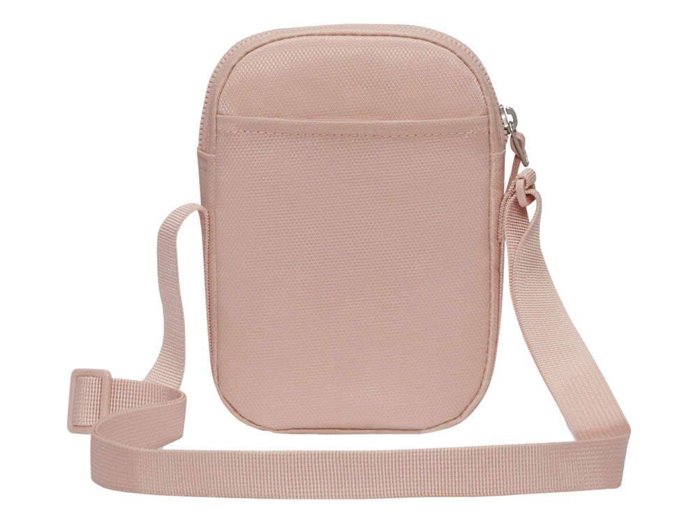 Bolsa de hombro Nike Heritage S en color rosa oxford con bolsillo frontal de malla y correa ajustable.
