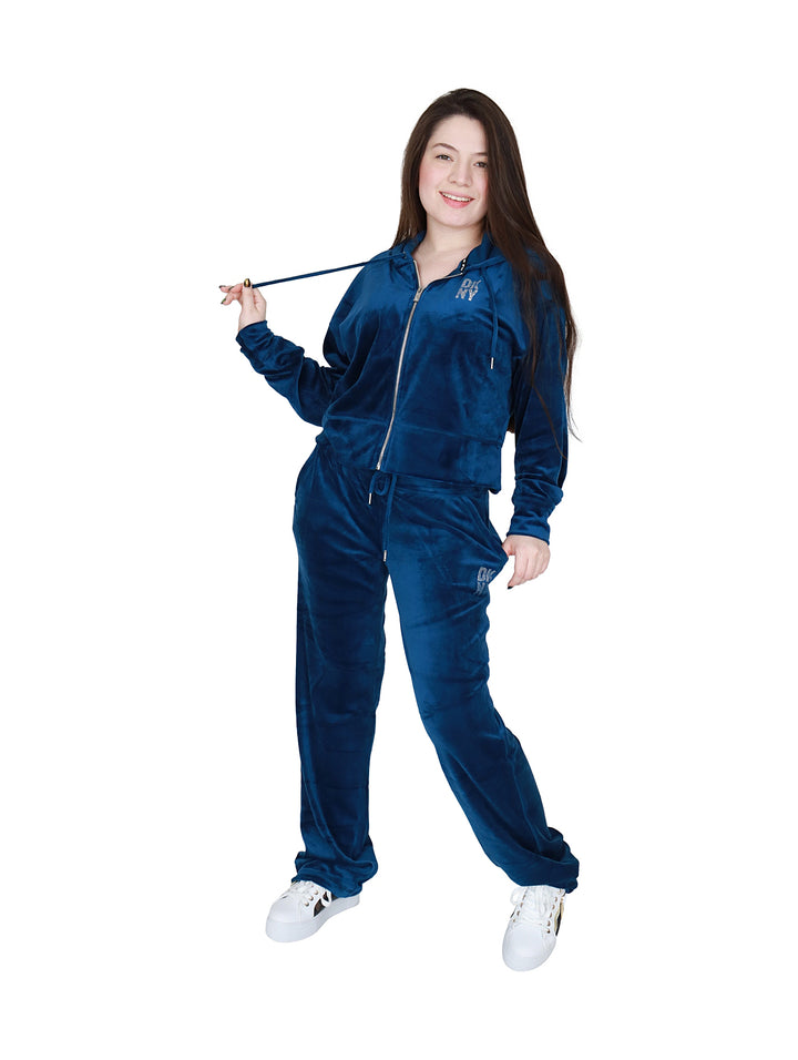 Pantalones deportivos DKNY color azul Poseidon en tela velour con logo de pedrería.