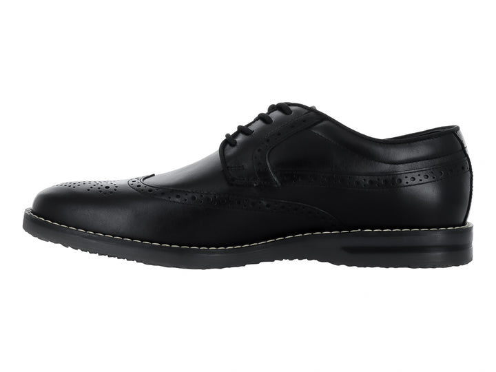 Zapato formal Oxford de cuero negro con detalles perforados tipo brogue y agujetas negras.
