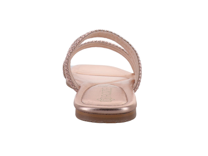 Sandalia plana color oro rosado con tiras decoradas con brillos.