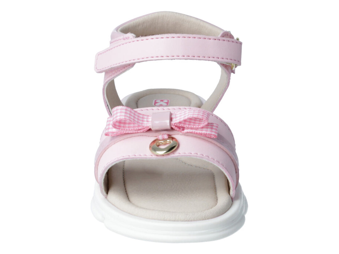 Sandalia rosa para niña con moño decorativo y suela blanca y rosa.