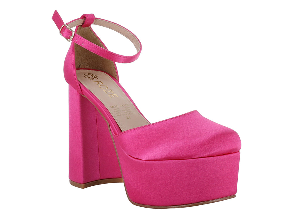 Zapato de tacón alto y plataforma en color pitaya con correa ajustable al tobillo.