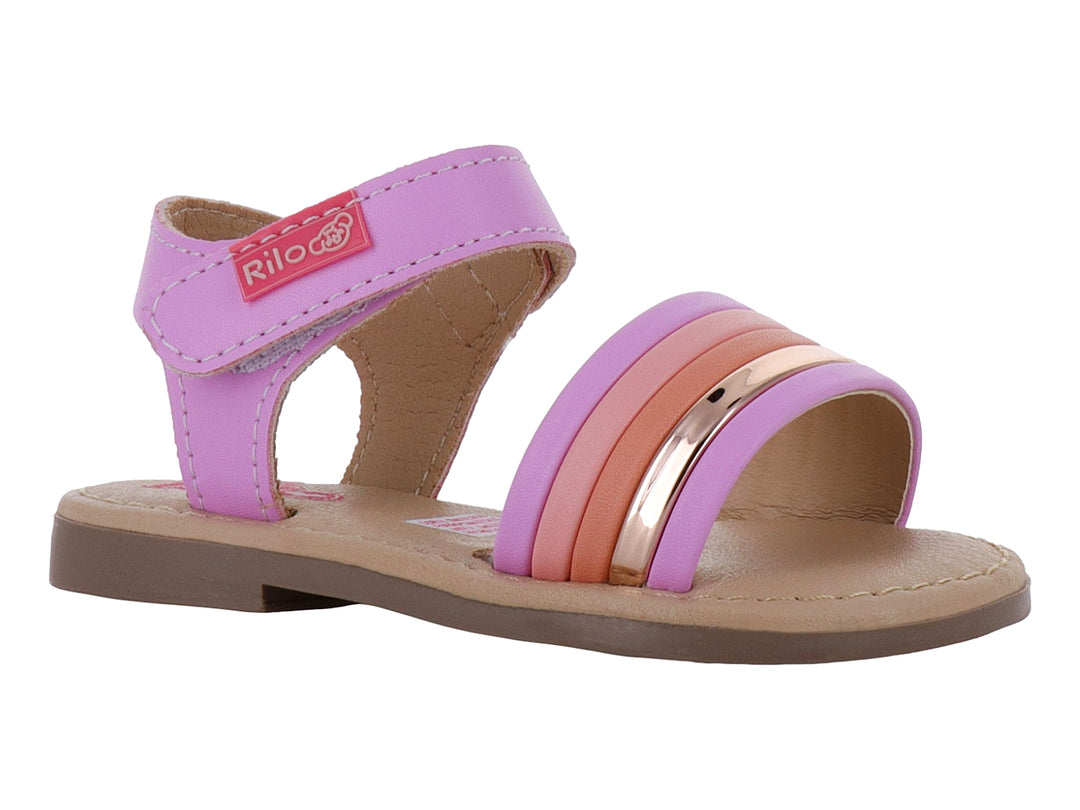 Sandalia plana para bebé en tonos rosa y morado con una tira dorada y correa ajustable.