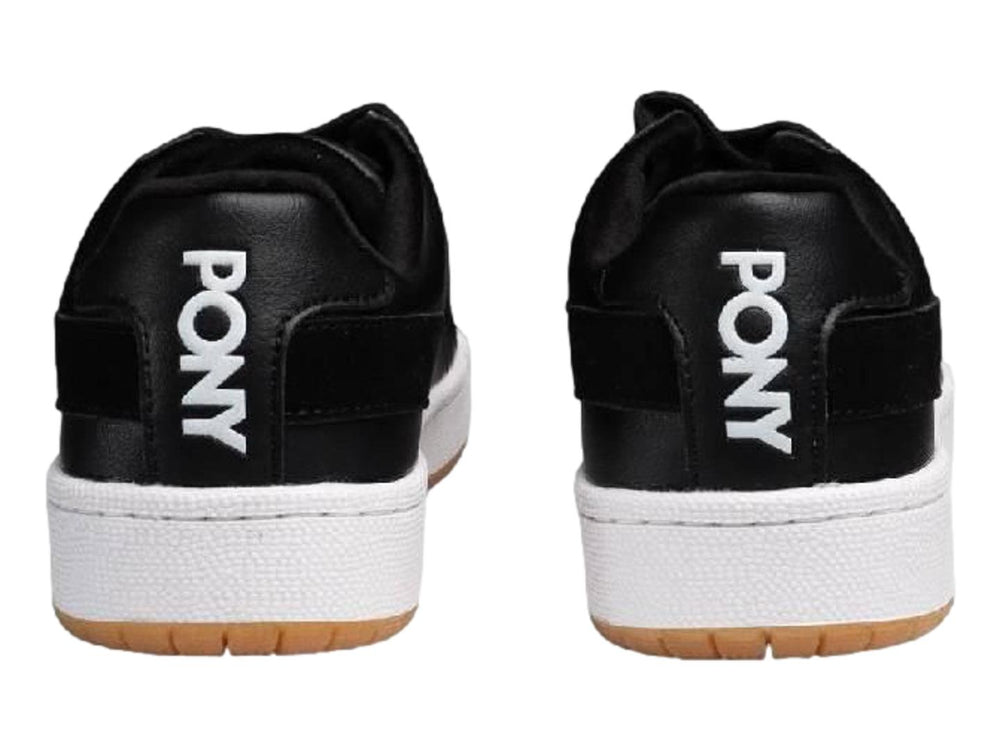 Tenis PONY Pro 80 color negro con suela blanca y base de goma marrón.