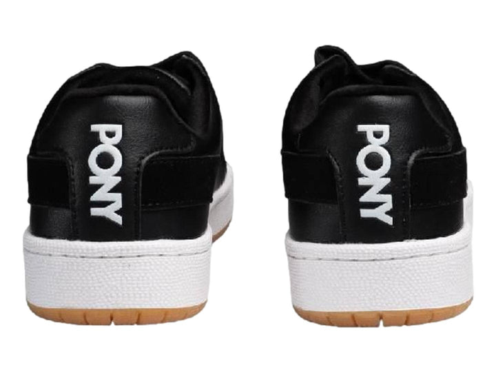 Tenis PONY Pro 80 color negro con suela blanca y base de goma marrón.