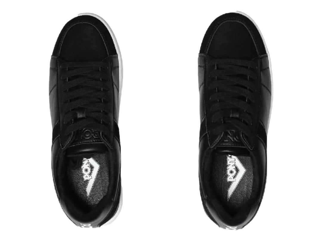 Tenis PONY Pro 80 color negro con suela blanca y base de goma marrón.