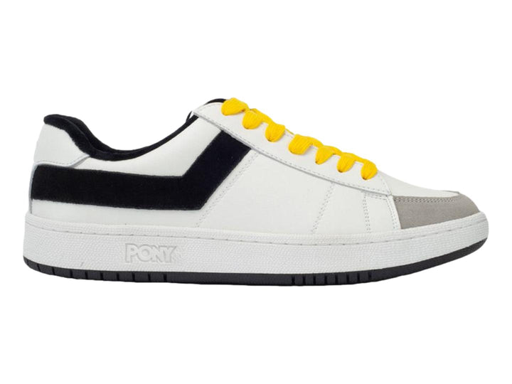 Tenis PONY blancos con franja negra lateral, agujetas amarillas y punta gris.