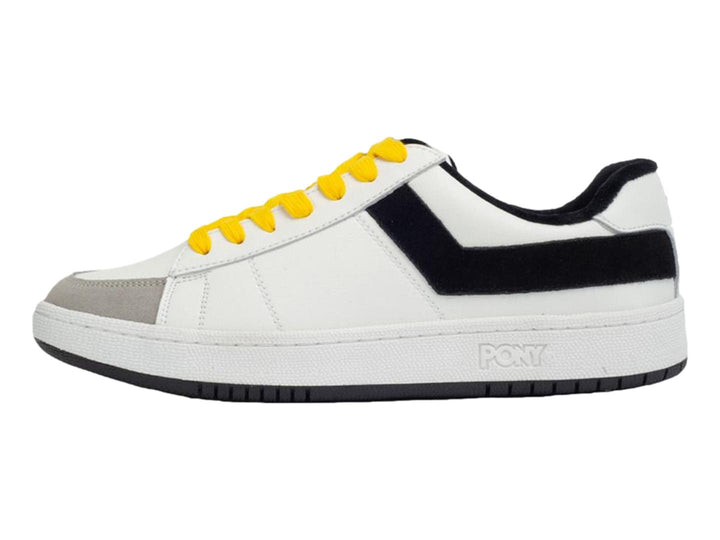 Tenis PONY blancos con franja negra lateral, agujetas amarillas y punta gris.