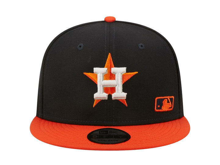 Gorra de béisbol New Era color navy con visera naranja y logo bordado de Houston Astros.