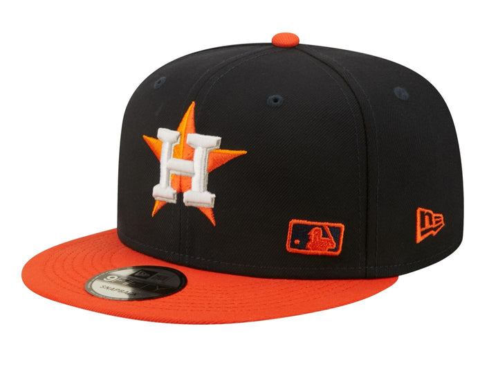 Gorra de béisbol New Era color navy con visera naranja y logo bordado de Houston Astros.