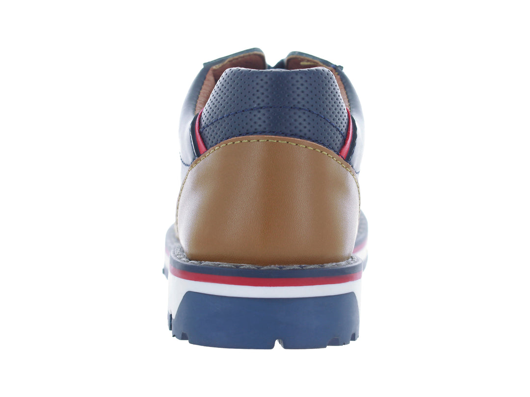 Tenis para niño color azul marino con detalles en café y rojo y suela blanca.