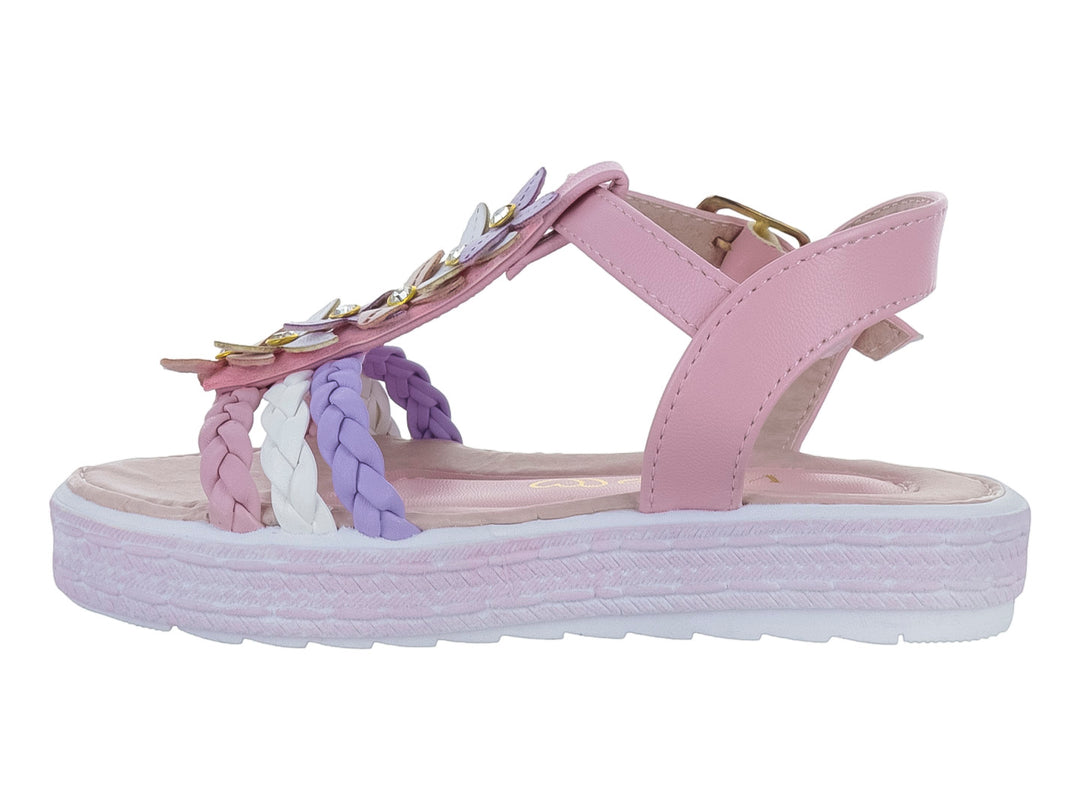 Sandalias rosas para niña con plataforma, tiras trenzadas en blanco y morado y adornos de flores con brillo.