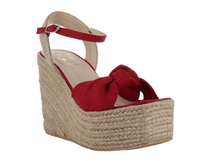 Sandalia de plataforma cuña color rojo fuego con detalle de moño y base de yute.