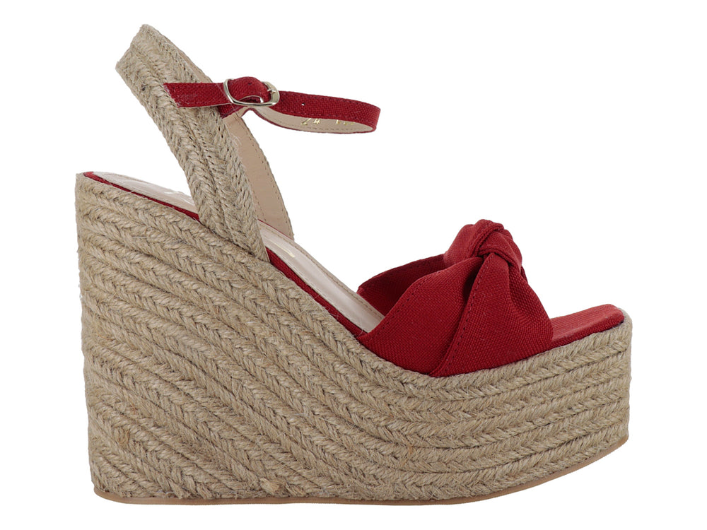 Sandalia de plataforma cuña color rojo fuego con detalle de moño y base de yute.