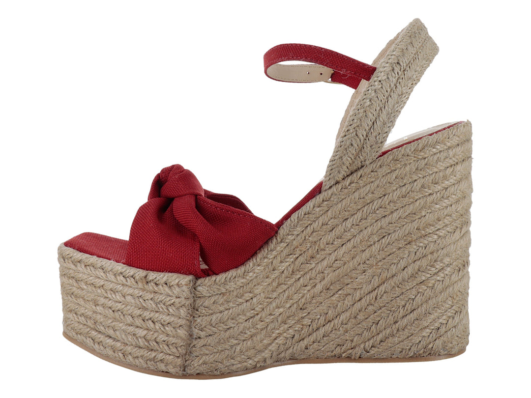Sandalia de plataforma cuña color rojo fuego con detalle de moño y base de yute.