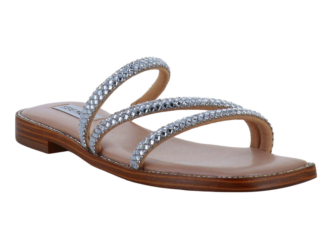 Sandalias planas de Steve Madden con tiras de brillantes plateados y plantilla beige.