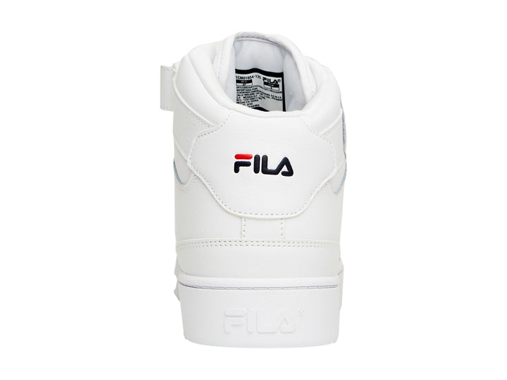 Tenis FILA MGX-100 Mid en color blanco con detalles en rojo y azul marino, con correa de velcro en el tobillo.
