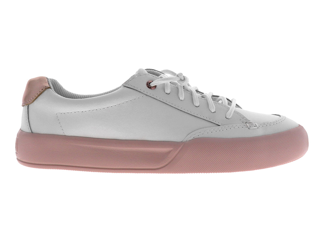 Tenis blancos de la marca Sperry con suela color rosa y cordones blancos.