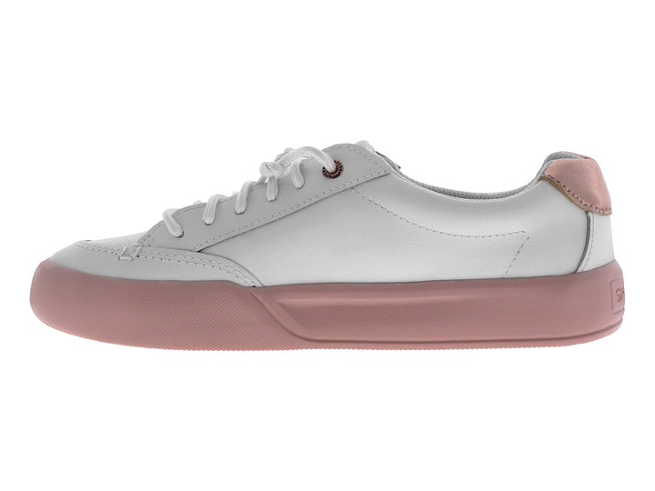 Tenis blancos de la marca Sperry con suela color rosa y cordones blancos.