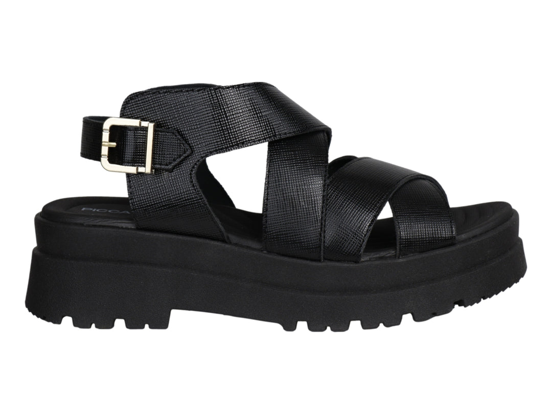 Sandalia de plataforma color negro con correas cruzadas y hebilla dorada.
